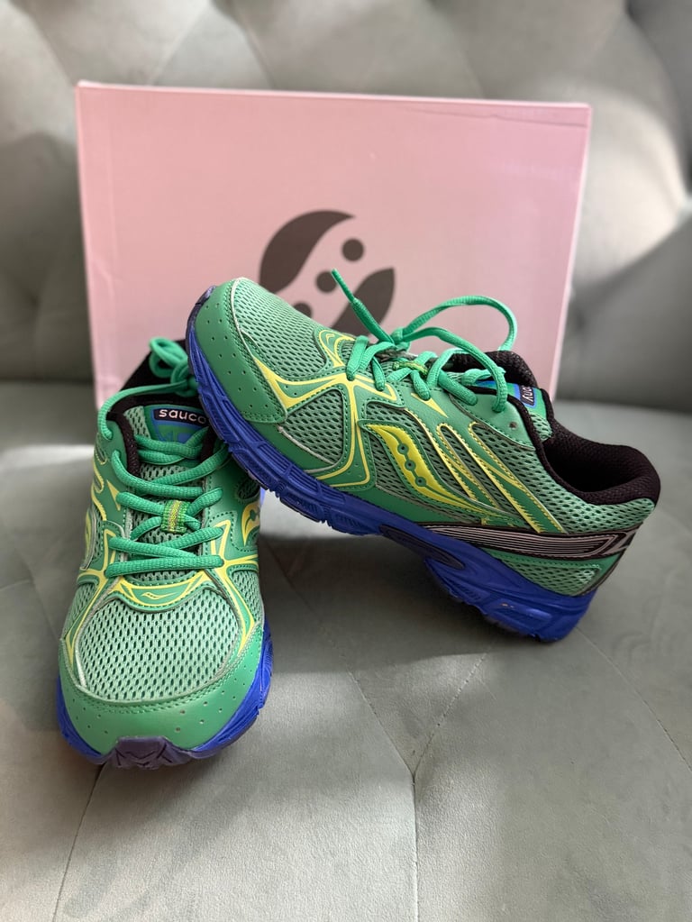 Saucony Ride Millennium KDZ Green white sneakers with black stripes on a blue box