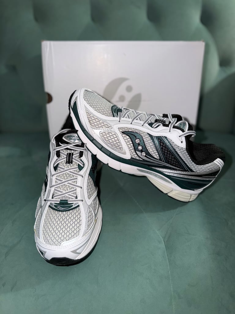 Saucony Progrid 7 White/Pine white sneakers with black stripes on a blue box